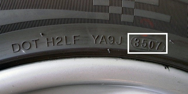 Location of a date code on motorcycle tires