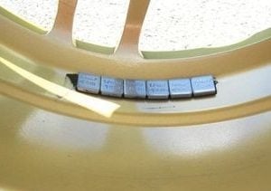 Wheel balancing adhesive weights
