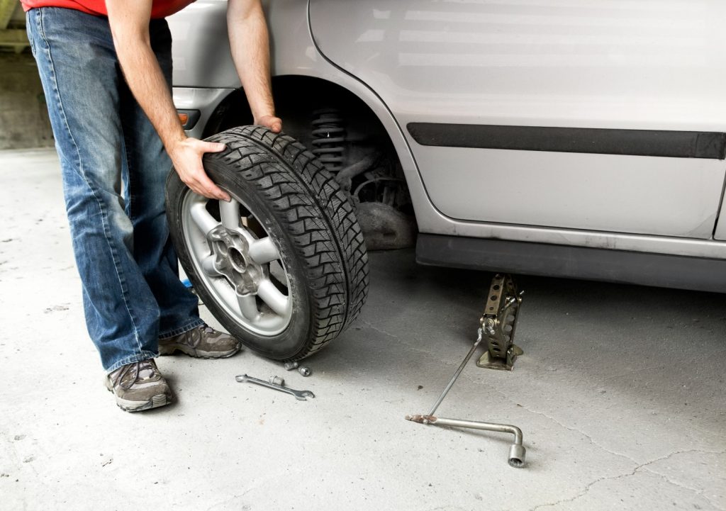 A man changing tire