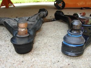 Worn and new ball joints