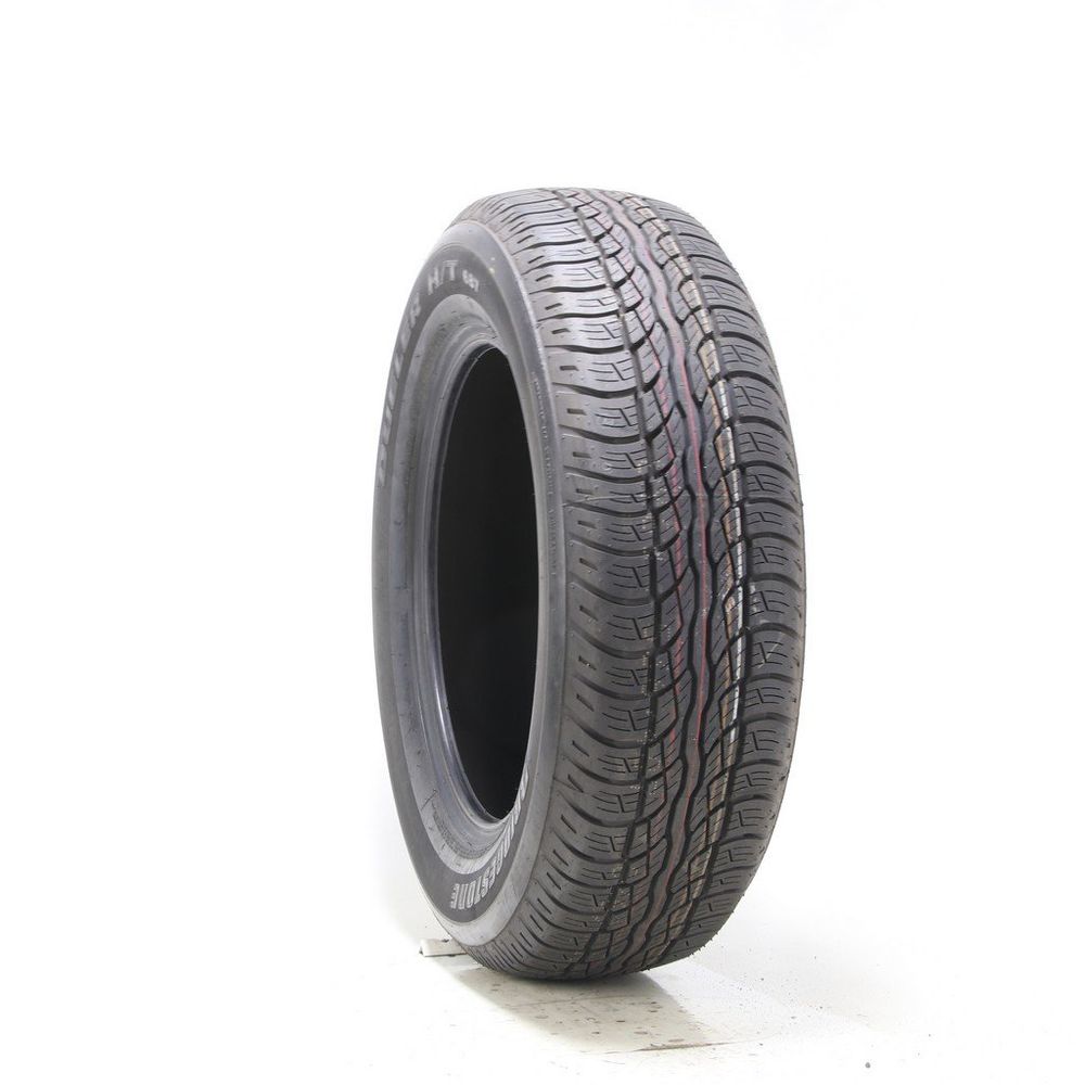 Set of (2) Driven Once 235/65R18 Bridgestone Dueler H/T 687 104T - 9.5/32 - Image 1