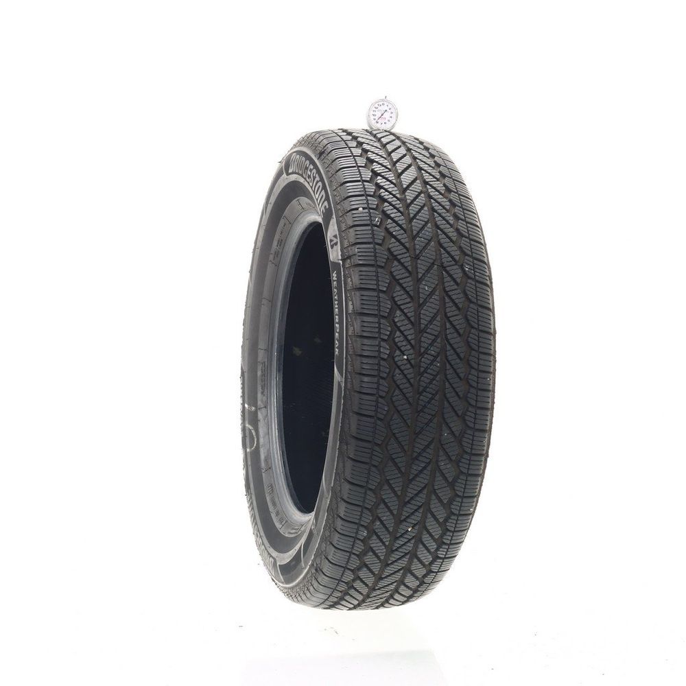 Set of (2) Used 235/65R18 Bridgestone WeatherPeak 106H - 8/32 - Image 1