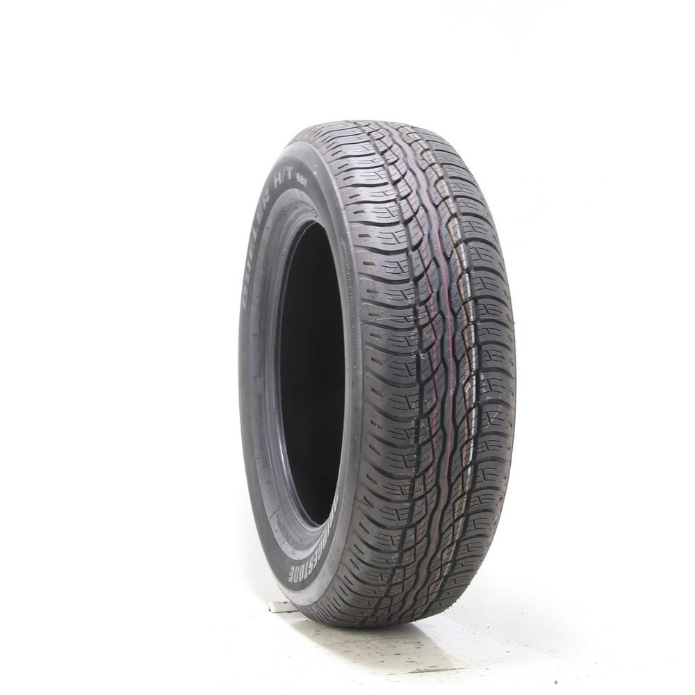 Set of (4) Driven Once 235/65R18 Bridgestone Dueler H/T 687 104T - 9.5/32 - Image 1