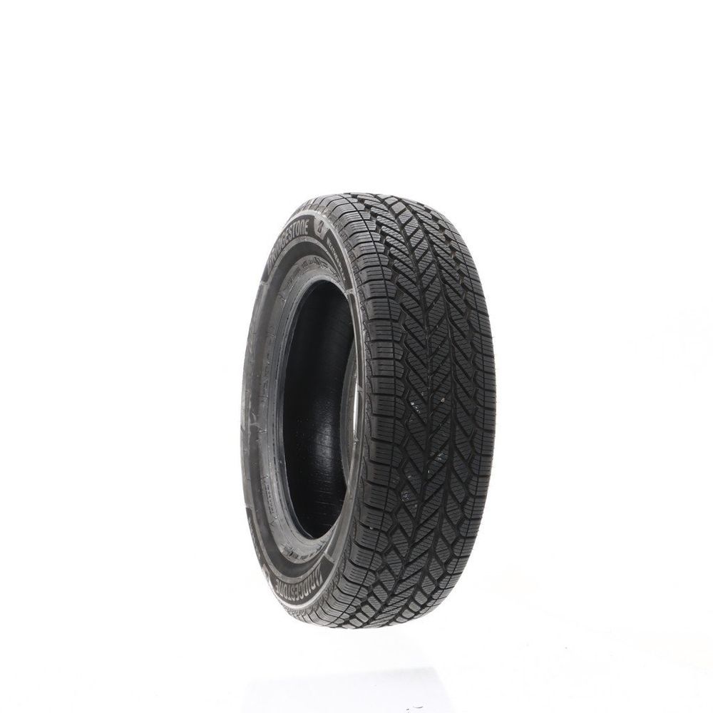 Set of (2) Driven Once 215/65R16 Bridgestone WeatherPeak 98H - 10/32 - Image 1