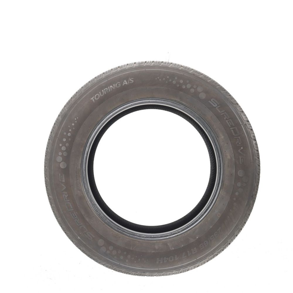 Set of (4) Used 235/65R17 SureDrive Touring A/S TA71 104H - 8/32 - Image 3